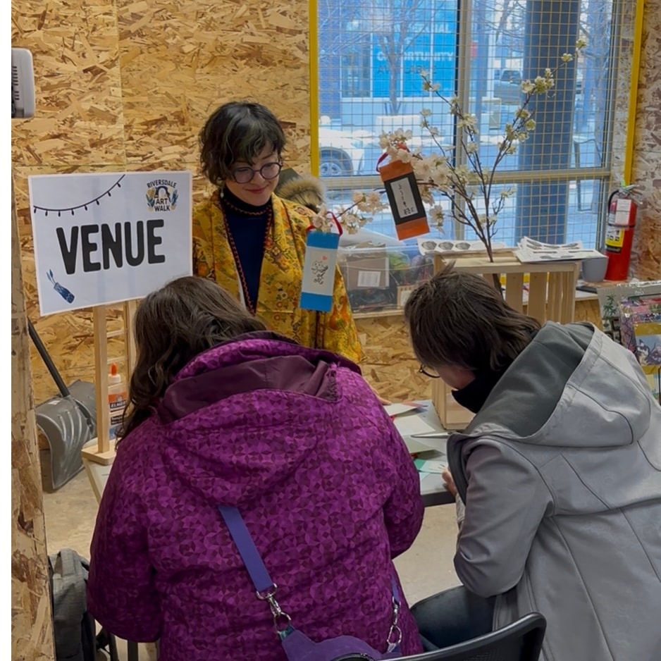 Chikako Ogawa in a kimono greeting visitors at a booth during the Riversdale Art Walk